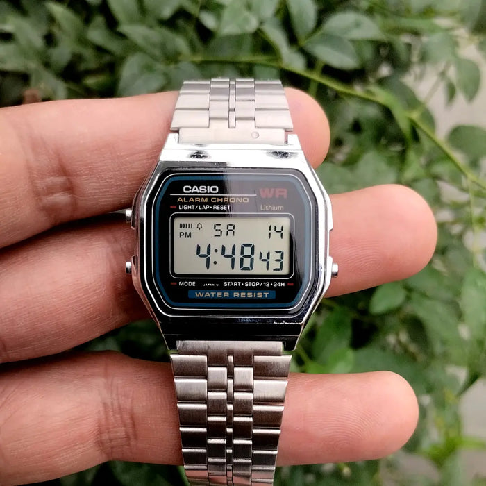 Casio A159W-N1DF watch with a classic rectangular digital display, chrome-plated resin case, and stainless steel band featuring a triple-fold clasp; includes LED light, daily alarm, stopwatch, and water resistance.