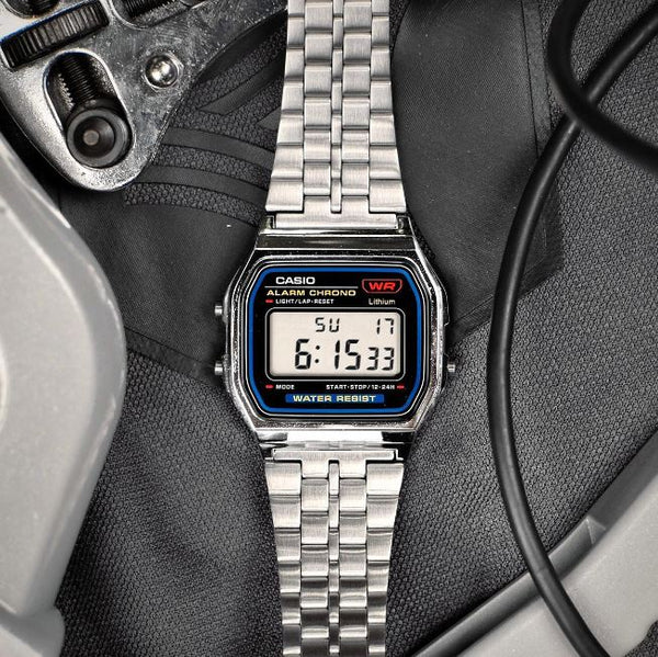 Casio A159W-N1DF watch with a classic rectangular digital display, chrome-plated resin case, and stainless steel band featuring a triple-fold clasp; includes LED light, daily alarm, stopwatch, and water resistance.