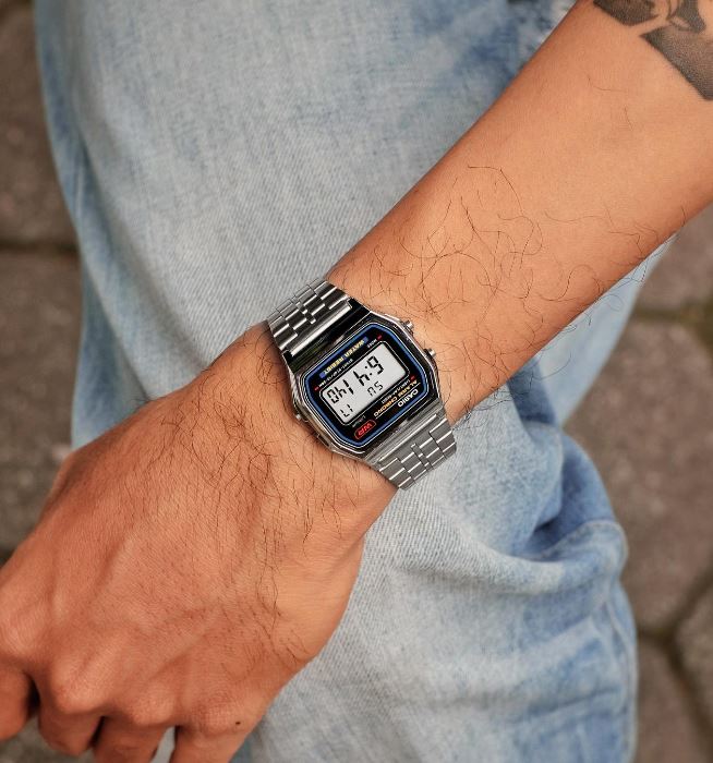 Casio A159W-N1DF watch with a classic rectangular digital display, chrome-plated resin case, and stainless steel band featuring a triple-fold clasp; includes LED light, daily alarm, stopwatch, and water resistance.