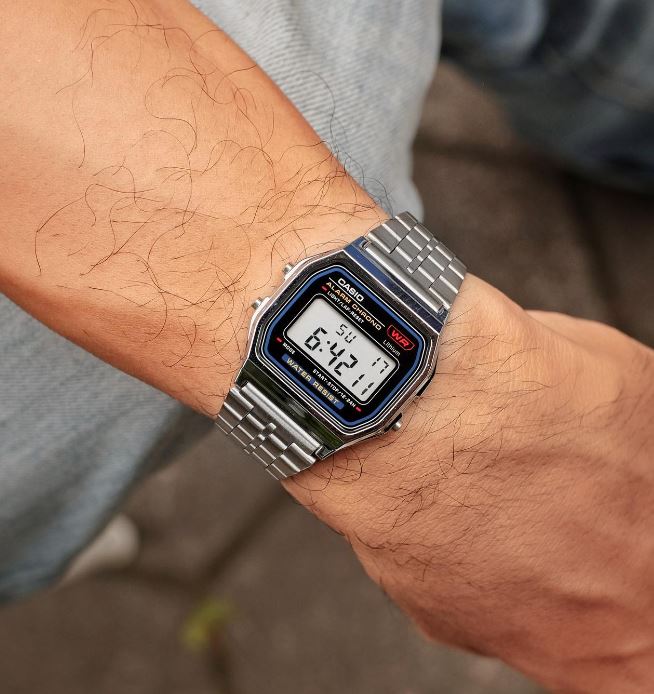 Casio A159W-N1DF watch with a classic rectangular digital display, chrome-plated resin case, and stainless steel band featuring a triple-fold clasp; includes LED light, daily alarm, stopwatch, and water resistance.