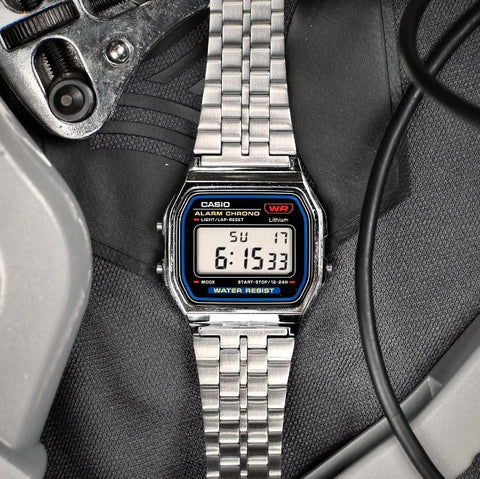 Casio A159W-N1DF watch with a classic rectangular digital display, chrome-plated resin case, and stainless steel band featuring a triple-fold clasp; includes LED light, daily alarm, stopwatch, and water resistance.