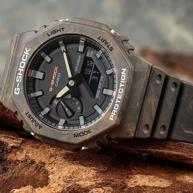 Casio G-Shock GA-2100FR-5A men's digital and analog watch with a rugged, camouflage-inspired design in brown and orange tones, featuring shock resistance,