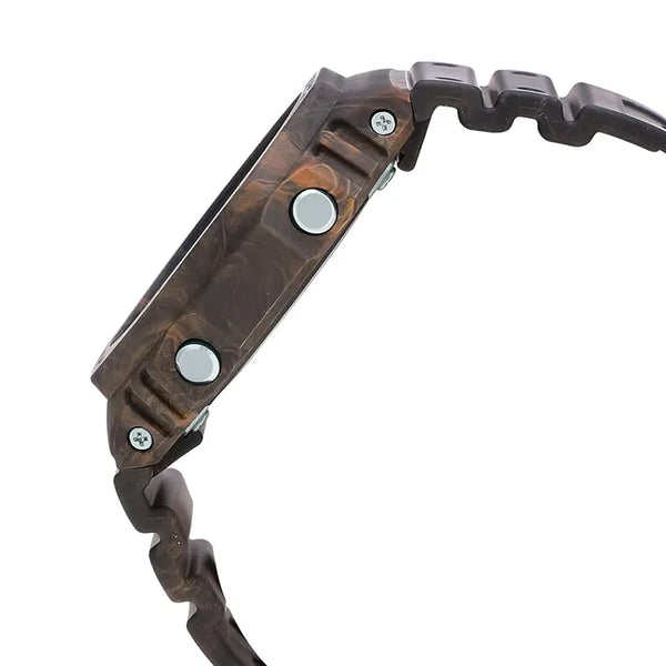 Casio G-Shock GA-2100FR-5A men's digital and analog watch with a rugged, camouflage-inspired design in brown and orange tones, featuring shock resistance