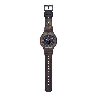 Casio G-Shock GA-2100FR-5A men's digital and analog watch with a rugged, camouflage-inspired design in brown and orange tones, featuring shock resistance