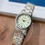 Casio LTP-V002SG-9A women's two-tone silver and gold metal watch with a gold dial and date display.
